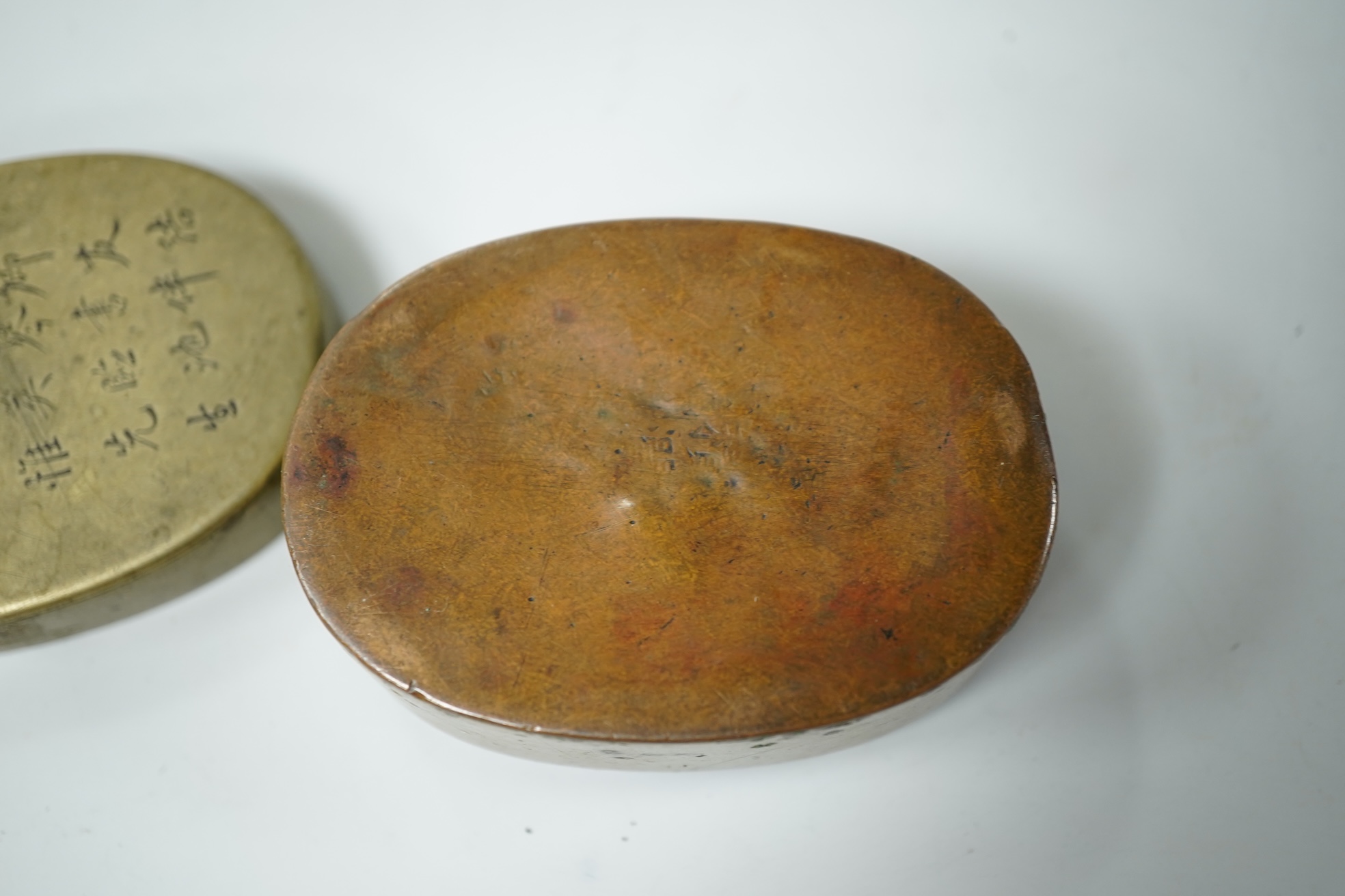 A Chinese inscribed paktong oval ink box, early 20th century, 6.5cm